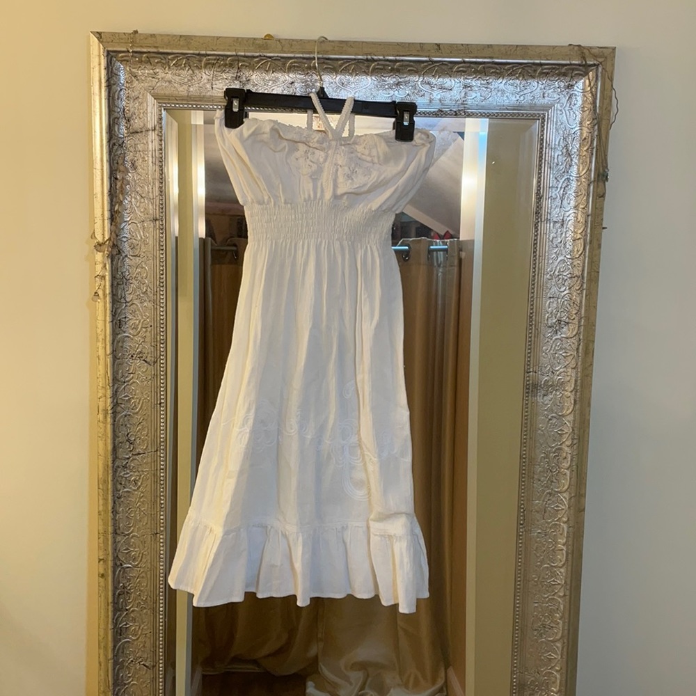 white halter dress embroidery detail on hem